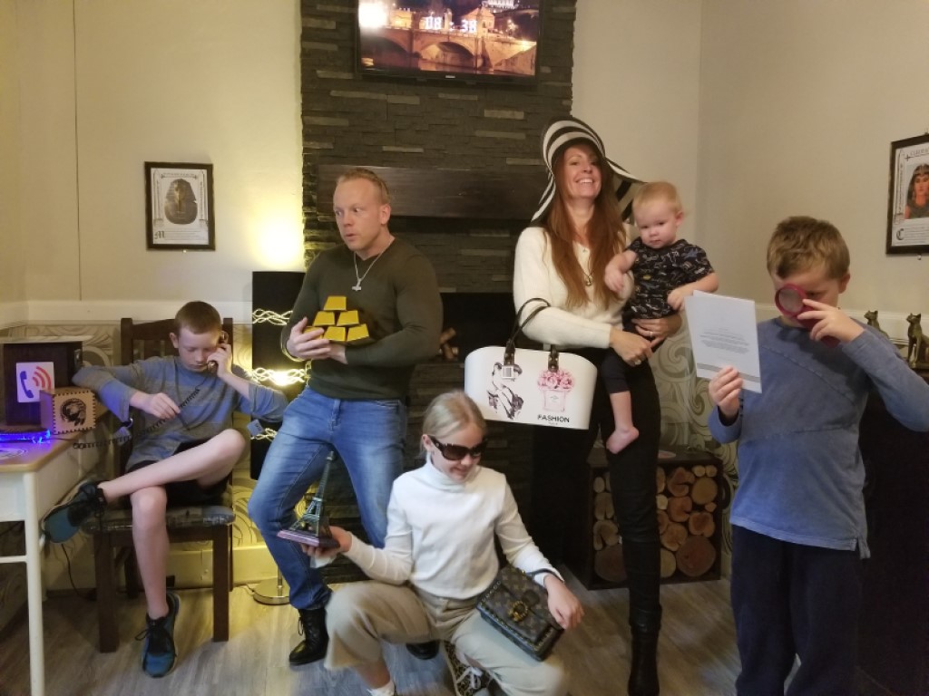 A family group enjoying The Inheritance Escape Room