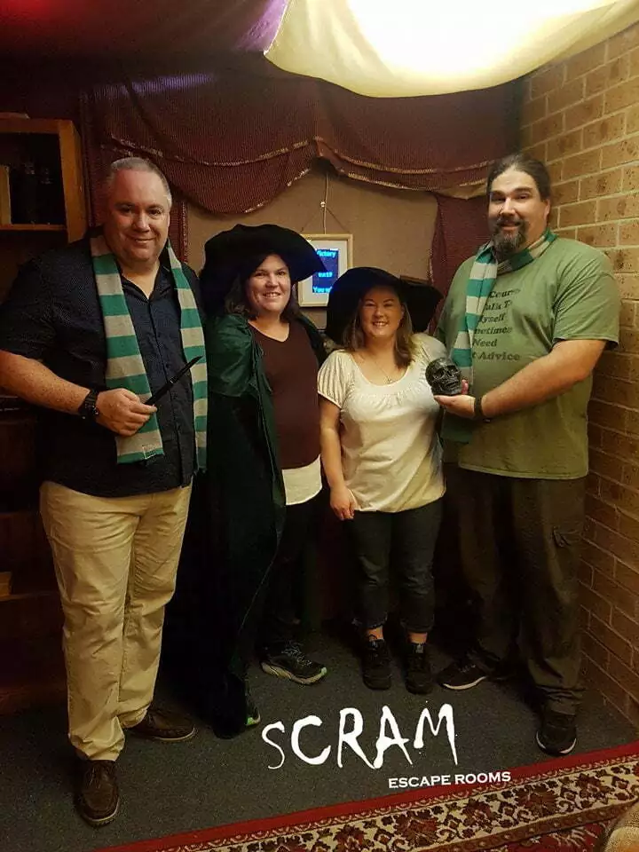 Narrow Escape Room owners dressed in wizard attire after playing their first ever escape room in Parramatta.
