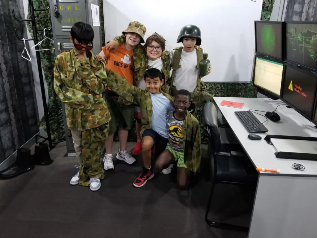 Teenagers celebrating a birthday party in our Launch escape room in Sydney.